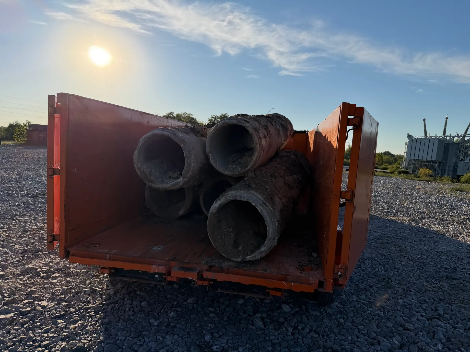 SiteTub Tub loaded with concrete pipe at a utility job site